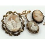 A bag containing three yellow metal mounted antique Cameo brooches.