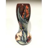 RED TULIP: A tall gourd shaped Moorcroft Pottery vase by Sally Tuffin (27cm).