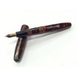 A Conway Stewart 15 marble bodied fountain pen with 14 carat gold nib