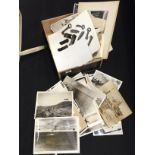 A box containing a quantity of contemporary WW2 black and white sea and air battle photographs