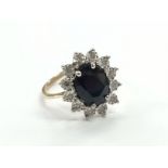 A 9 carat gold sapphire and diamond set dress ring.