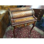 A French design roll top writing desk with lift-over writing slope fitted a drawer,