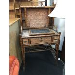 A Victorian Aesthetic period bamboo writing desk in the Japanese style with marbled interior,