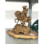 A gold painted Spelter figure modelled as Warrior on Horseback on Gesso stand (29cm overall).