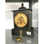 A late 19th century small slate cased mantle clock with acorn finial (33cm).