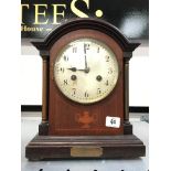 An early 20th century inlaid mahogany mantle clock with urn decoration,