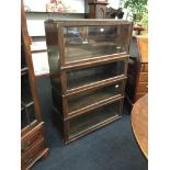 An incomplete Globe Wernicke bookcase with lift-top doors.