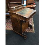 A Victorian walnut veneered Davenport fitted four drawers, lift-top envelope container,