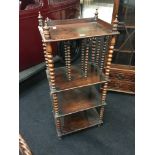 A Victorian stained as beech three tier whatnot with turned bobbin twist supports.