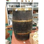 A brass bound oak barrel umbrella stand (61cm).