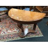 A Victorian mahogany Duchess dressing table resting on carved lions paw central foot.