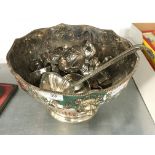 A silver plate on copper punch bowl together with a set of metal punch cups and a ladle.