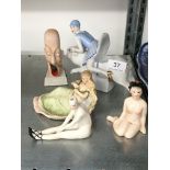 Four various Art Deco style china female figures together with a china match striker modelled as