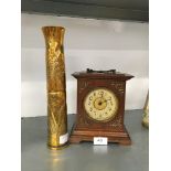 A small late 19th century mahogany cased mantle clock together with a brass Trench Art shell case