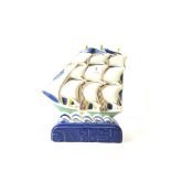 A modern Poole Pottery Studio flatback model of a Galleon in full sail, decorated in traditional