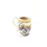 A Poole Pottery traditional jug shape 305 (4" / 10cms) decorated in the Truda Carter pattern OY