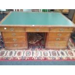 A large oak partners twin pedestal desk with doors to back and drawers to front with fitted with