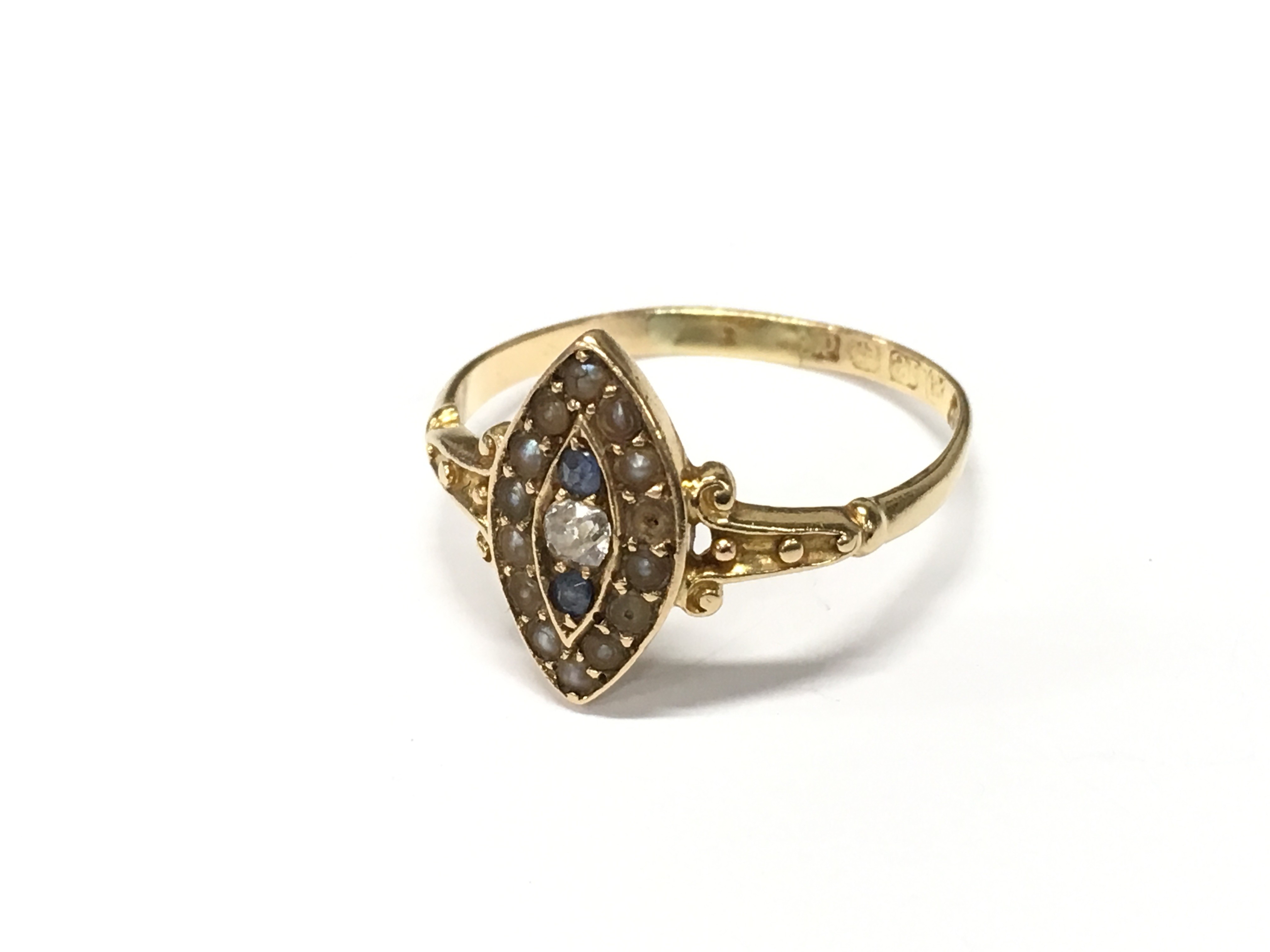 An 18ct yellow gold Diamond, Seed Pearl and Sapphire antique ring. Size S. Some damage to Pearls.
