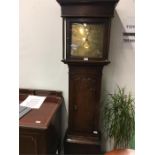 An early 19th century oak cased longcase clock with brass dial.