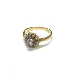 An 18 carat gold and diamond petal formed cluster ring.