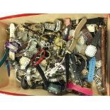 A large box of assorted watches.