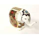 A Royal Crown Derby bone china paperweight modelled as an elephant decorated in the Imari pattern (