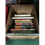 A box containing a collection of various railway related books.