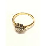 An 18ct yellow gold Diamond cluster ring size M.