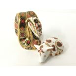 A Royal Crown Derby bone china paperweight model of a snake decorated in the Imari pattern, gold