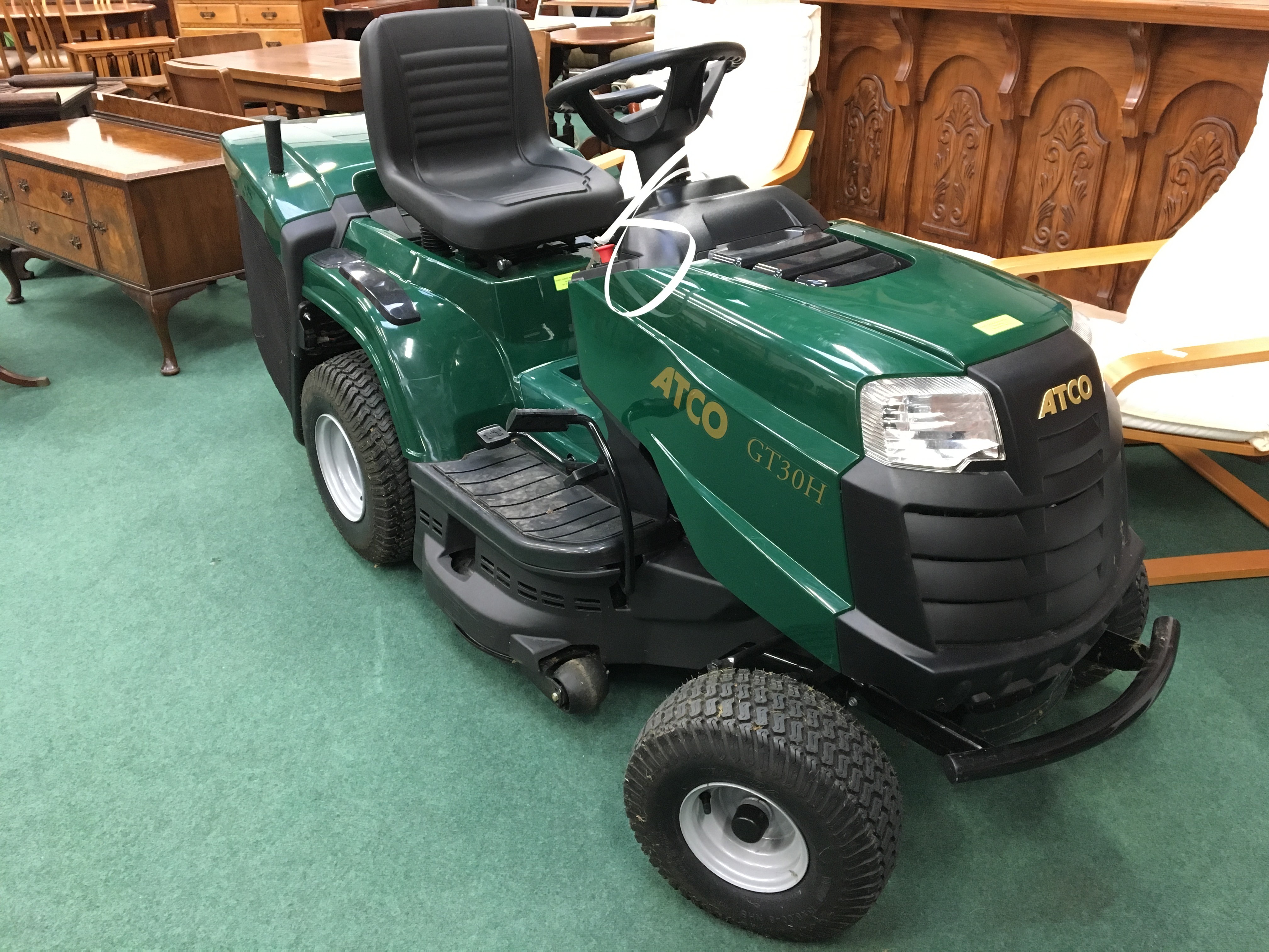 A Atco G T 30H petrol driven sit on mower powered by Briggs & Stratton.