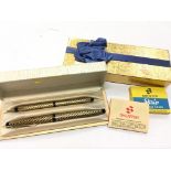 A Sheaffer golden basket weave fountain pen and pencil set presented in the original sheaffer box.