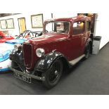 A vintage Austin Ruby 7 Historic vehicle in a maroon colour, First registered in 1937 this vehicle