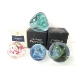 Four various Caithness glass paperweights.