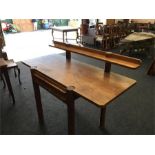 An Arts and Crafts oak buffet table with drawer to front and back shelf.