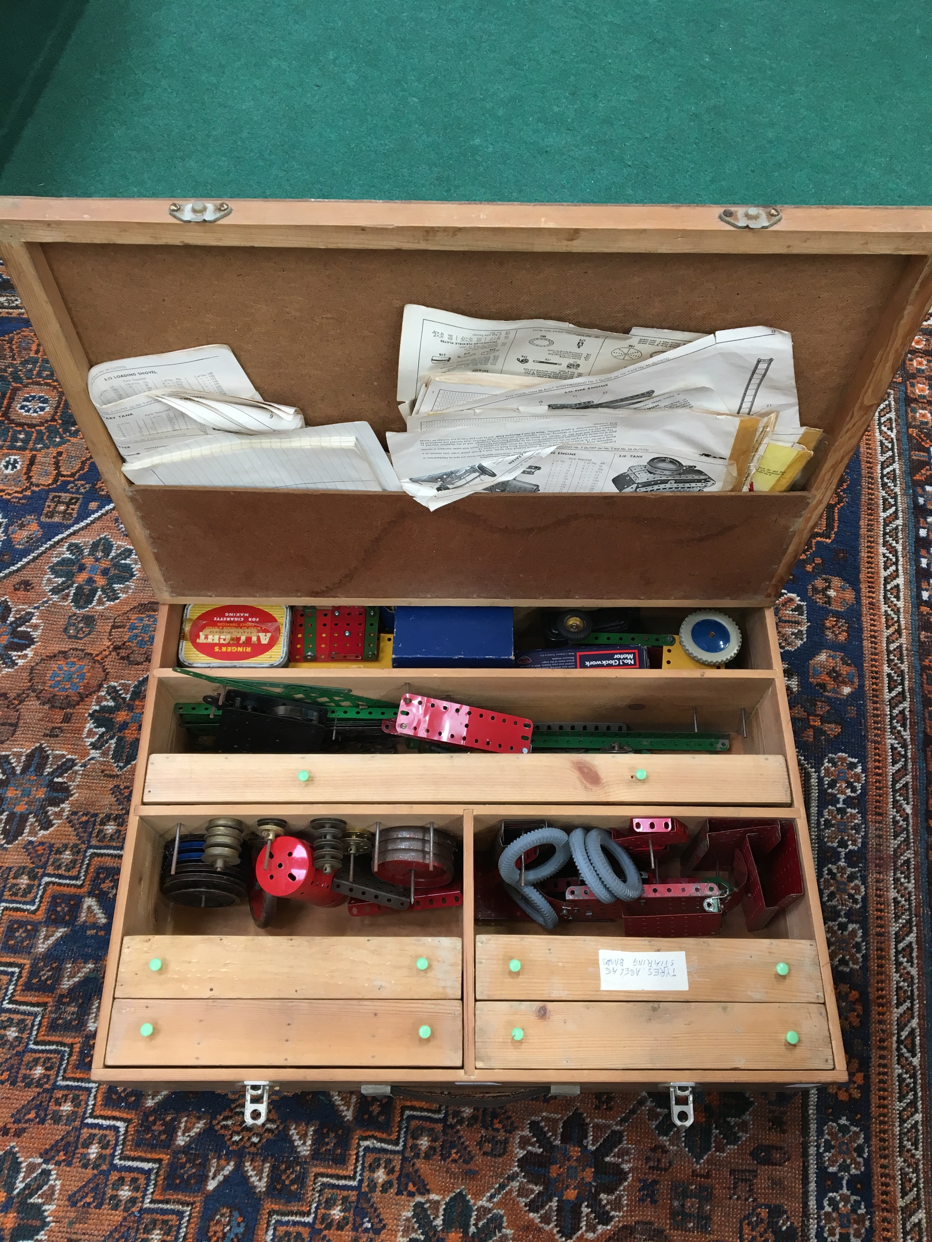 A mid 20th century pine case containing a large quantity of vintage meccano items.