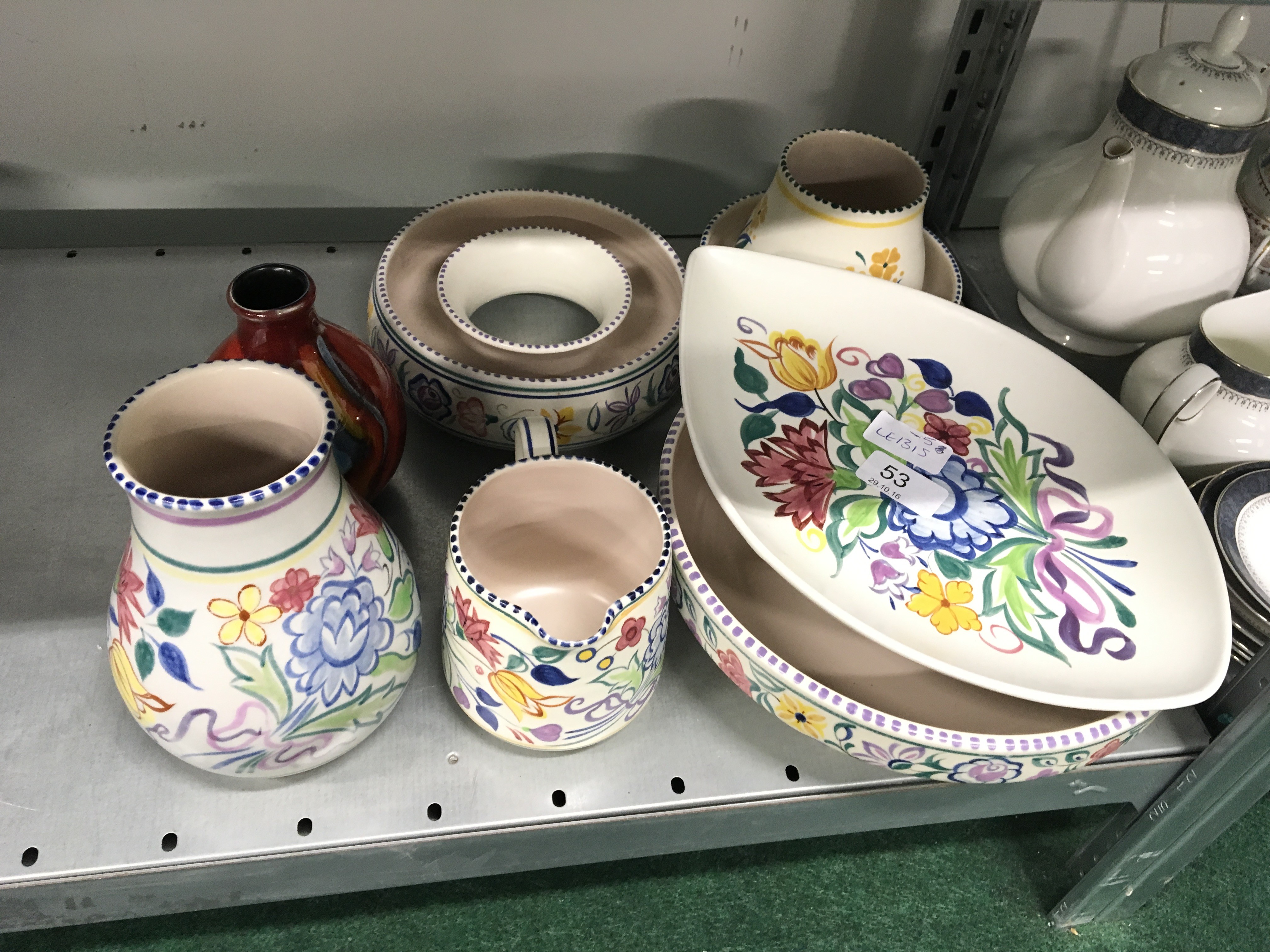 Seven various Poole Pottery white bodied traditional pattern items to include a vase decorated in