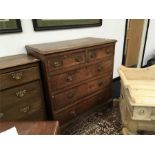 A 19th century oak chest of drawers with two small drawers over three with brass drop handles and