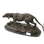 A late 19th century style metal sculpture modelled as a Springer Spaniel on stepped marble base.