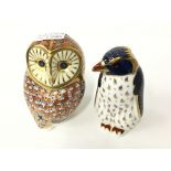 A Royal Crown Derby bone china paperweight modelled as an owl with gold stopper, signed markings