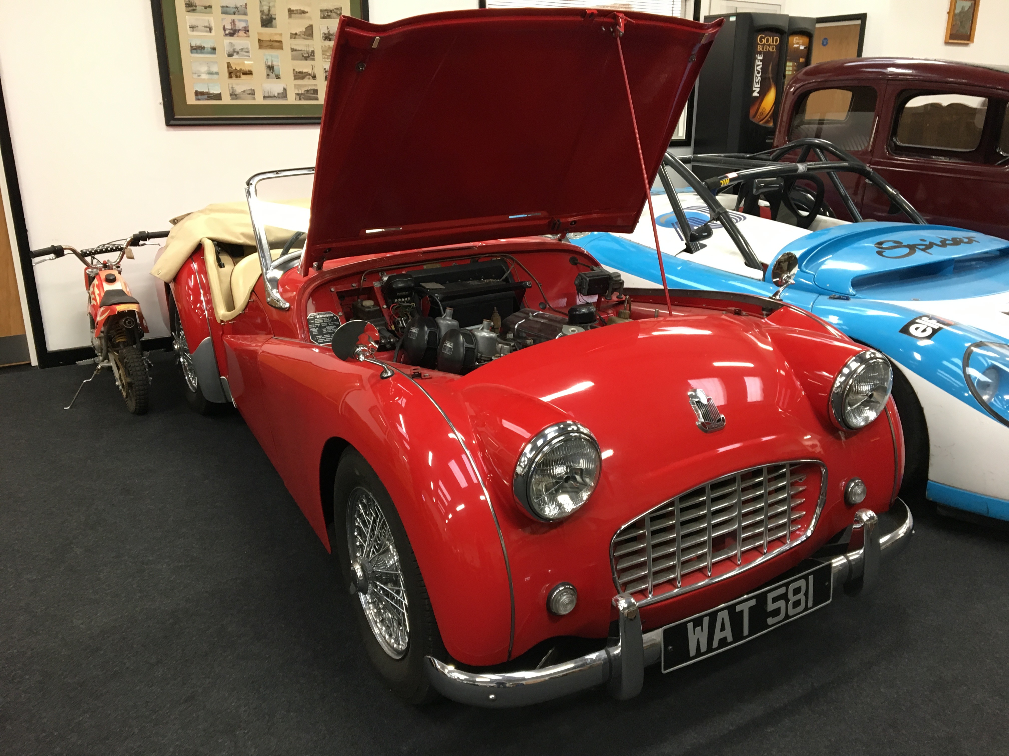 A Classic red Triumph TR3 First registered in 1957 and fitted with a 1991cc petrol engine.A historic
