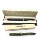 A Conway Stewart Dinky 560 fountain pen with 14 carat gold nib together with a Parker Junior Duofold