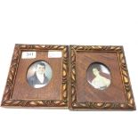 A pair of 19th century hand painted oval miniatures on ivory depicting a classic gent and lady in