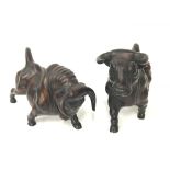 A pair of resin sculptures modelled as bull's.