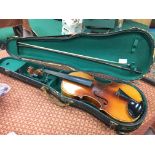 A 20th century wooden cased violin with bow in fitted case.