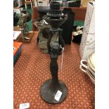 A reproduction Art Nouveau style metal table lamp designed as a young lady with her hands above