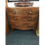 A Regency mahogany bow front chest of drawers on outswept bracket feet.