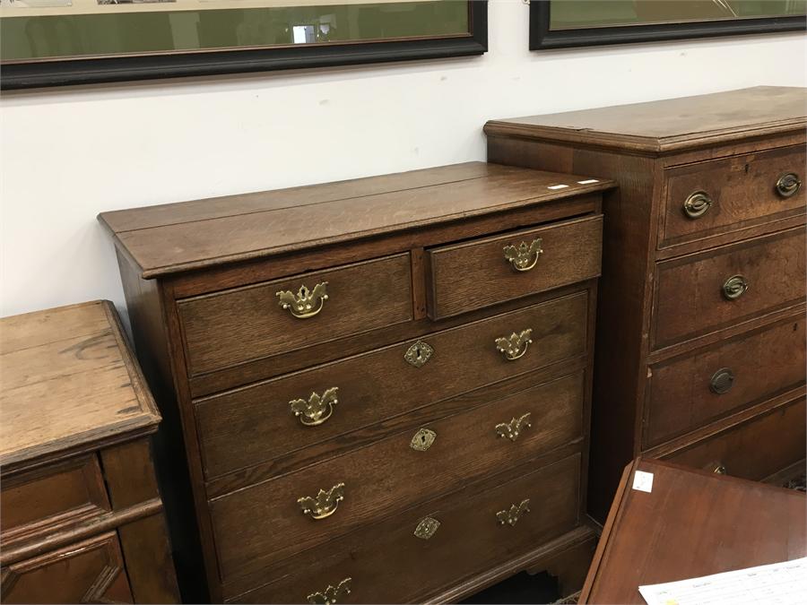 A 19th century oak chest of drawers, two small drawers over three large drawers with brass drop