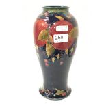 A large William Moorcroft baluster shaped vase decorated in the pomegranate pattern, signed and