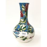 A Moorcroft pottery baluster shaped trial vase, decorated in snow and berries design, circa 2007,