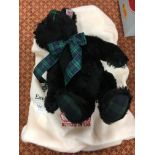 A black Steiff teddy musical teddy bear with original bag.